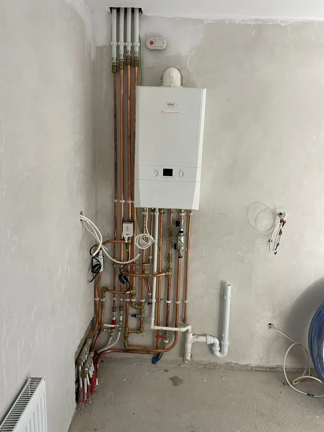 A newly installed gas boiler with tidy copper pipework
