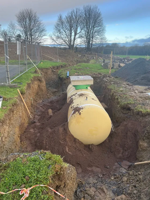 A bulk LPG tank being installed in a trench at a rural house in north Cork